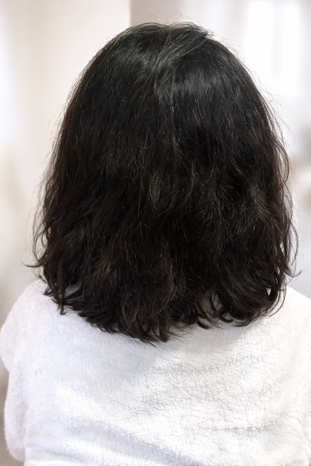 Alisado japonés antes cabello con frizz en Flores CABA