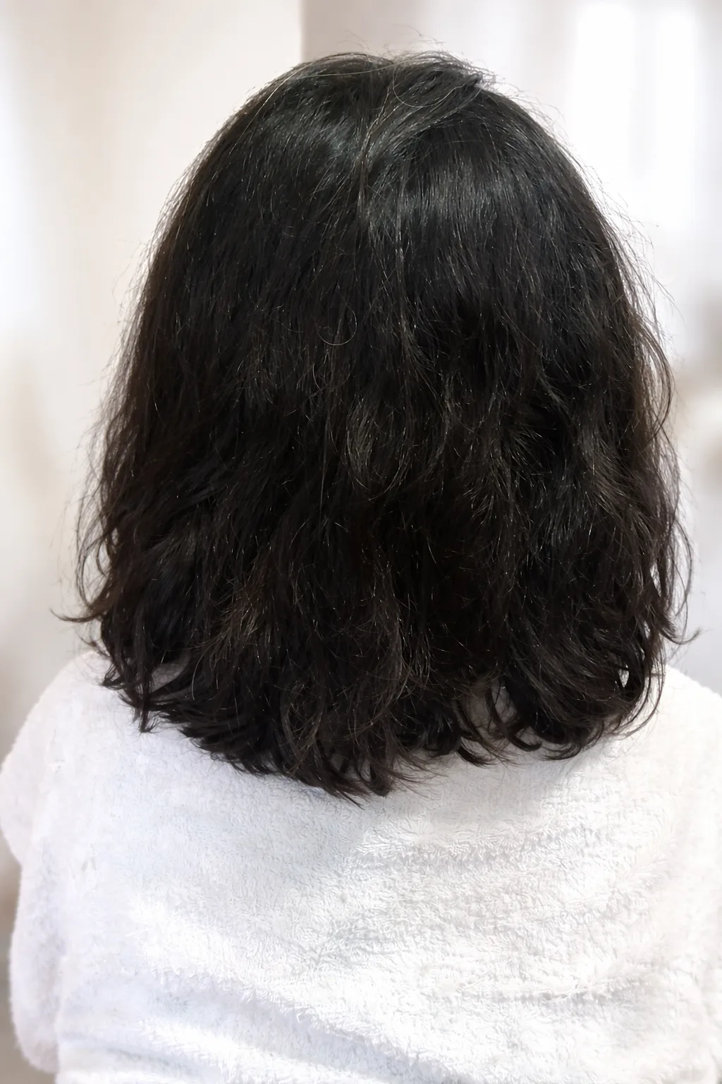 Alisado japonés antes cabello con frizz en Flores CABA